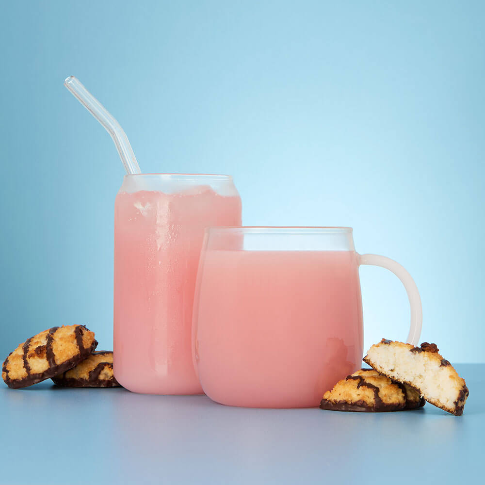 Coconut macaroon iced and hot tea in glass cup and mug with coconut macaroon biscuits