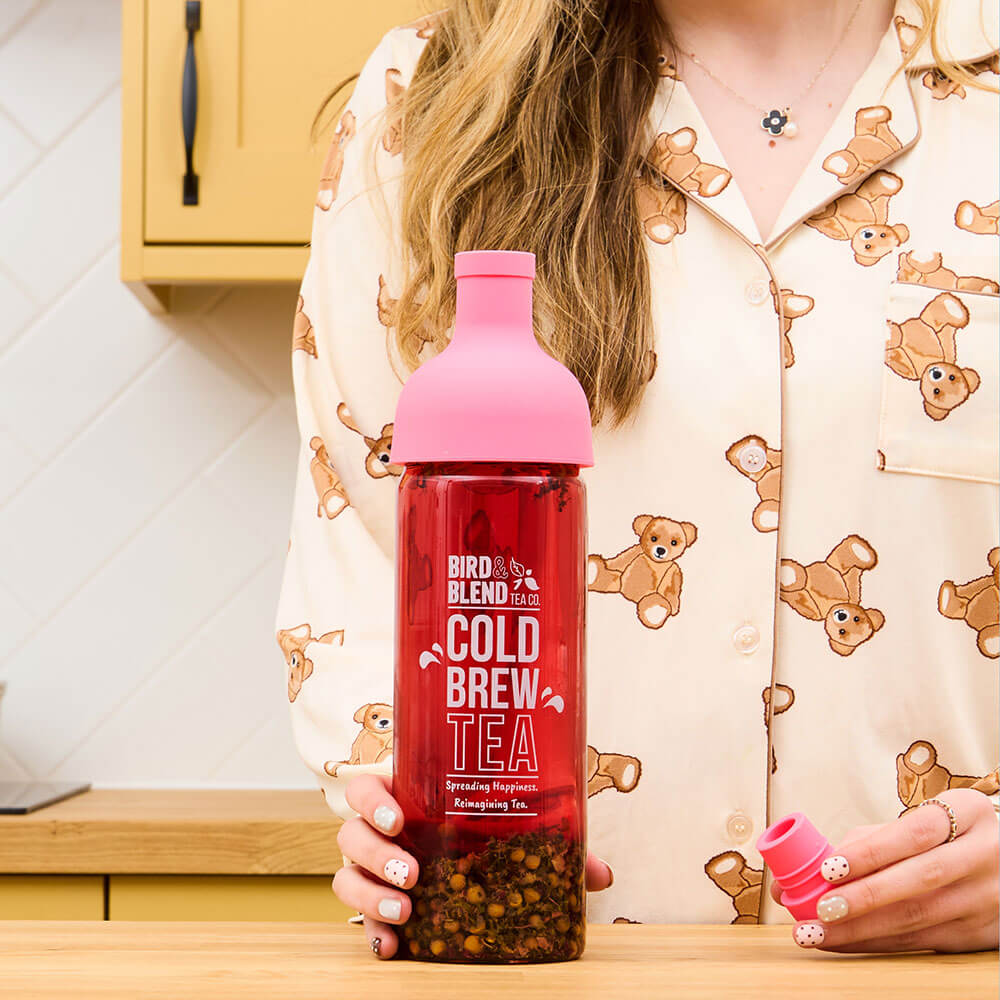 dozy girl tea in pink cold brew bottle