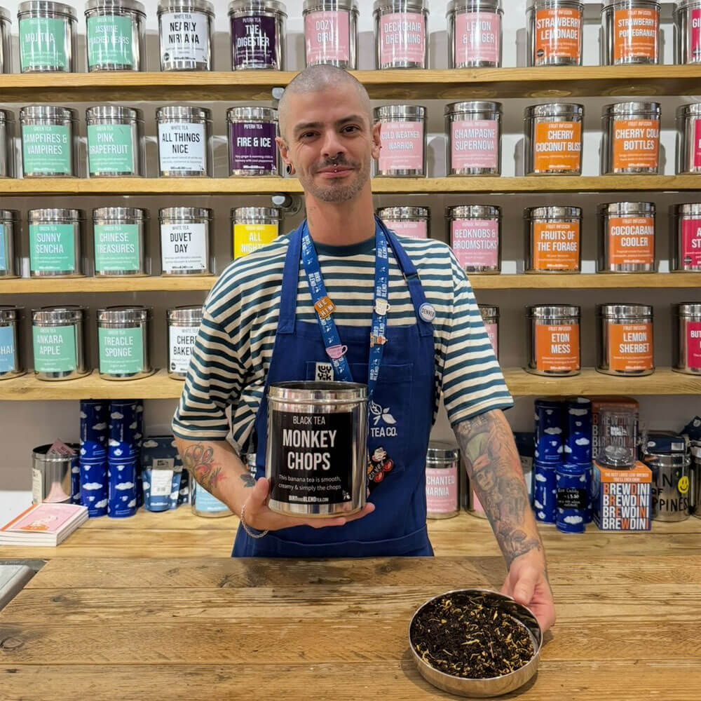 manchester store manager holding monkey chops tea tin