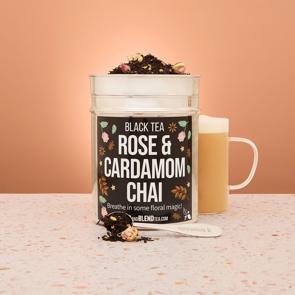 rose and cardamom chai black tea tin with hot tea and tea spoon