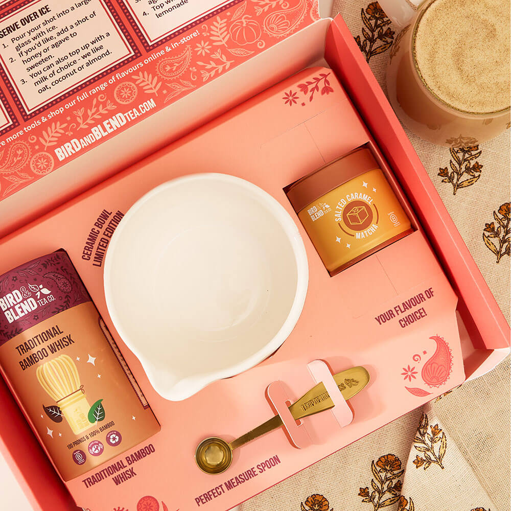 deluxe traditional whisking matcha &amp; tea powder set open with pink &amp; white ceramic bowl traditional bamboo whisk &amp; salted caramel matcha &amp; gold measure spoon