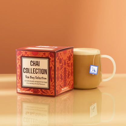 chai tea bag gift cube next to a hot chai latte with tea bag inside