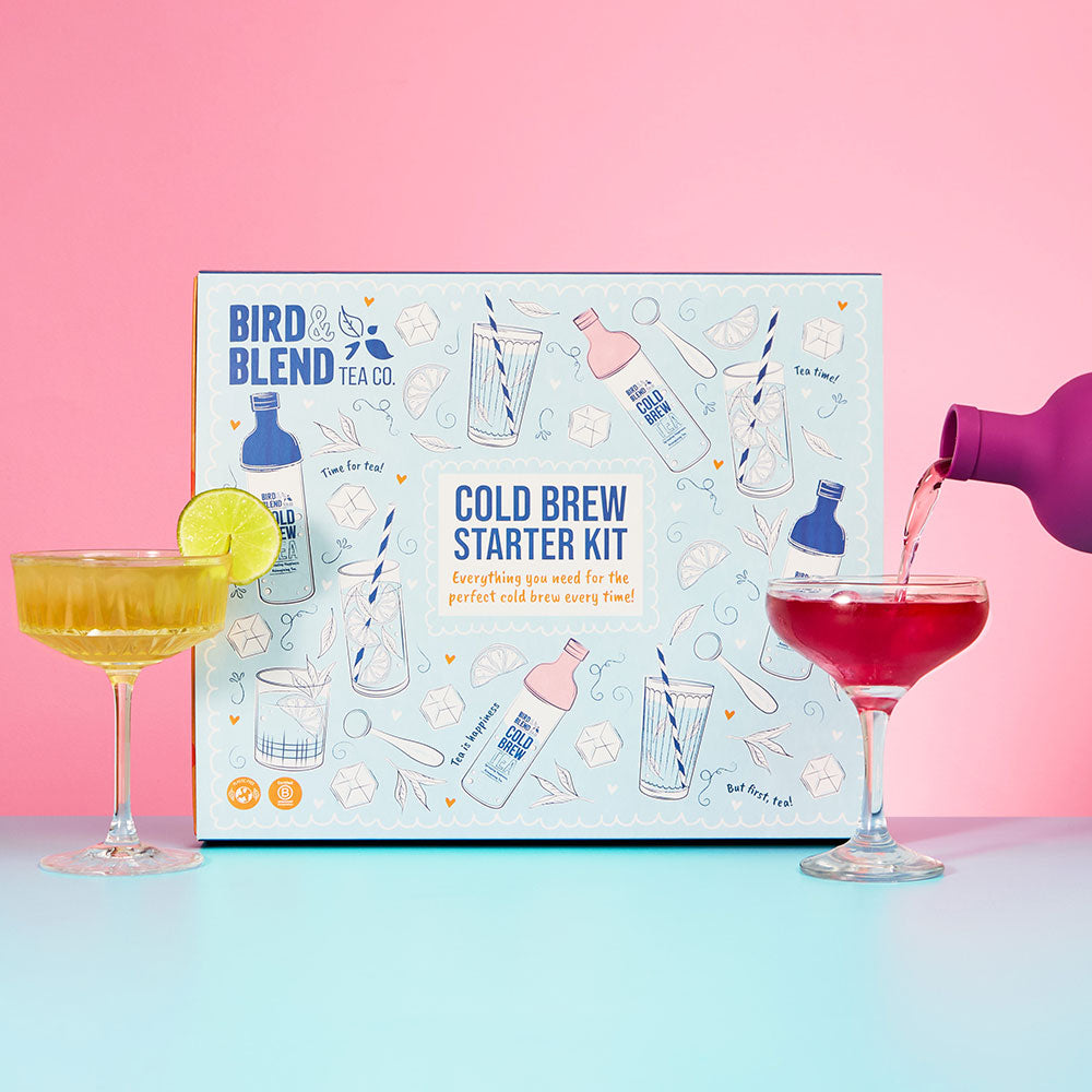 cold brew tea mocktail starter kit and two mocktails in glasses with plum purple cold brew tea bottle pouring tea