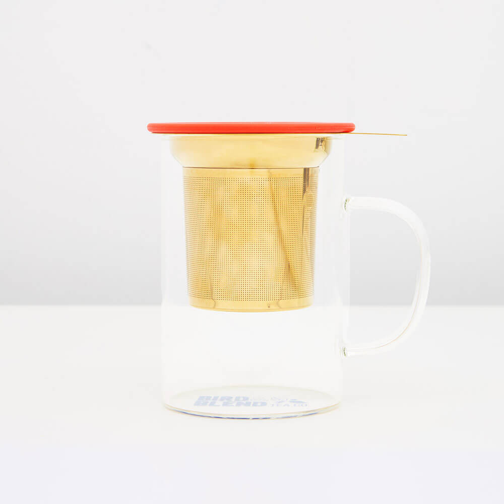 loose leaf infuser in gold in a mug