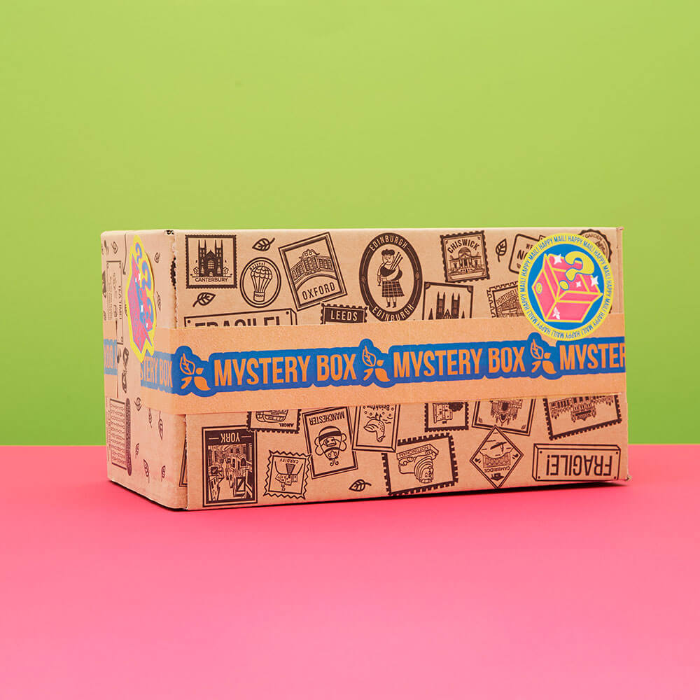 green and pink background with mystery tea box