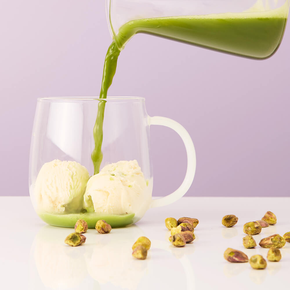 pistachio gelato matcha tea pouring on vanilla ice cream