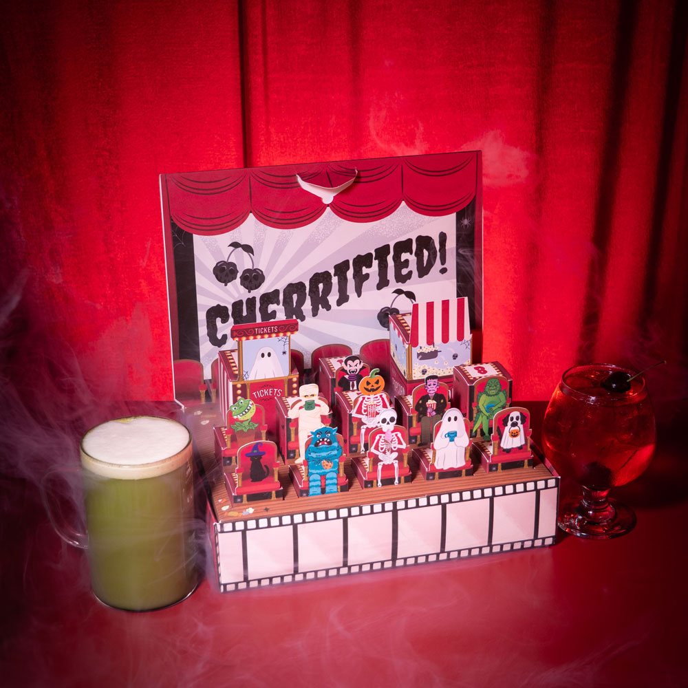  spooky countdown calendar open showcasing all characters & hot matcha latte and iced cherry tea 